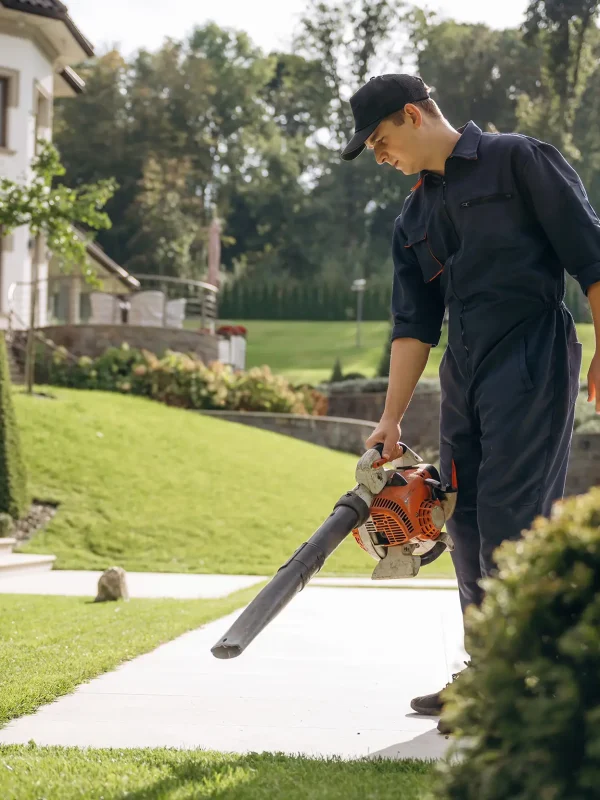 man-using-leaf-blower-on-residential-property-2026-03-24-07-12-56-utc copy
