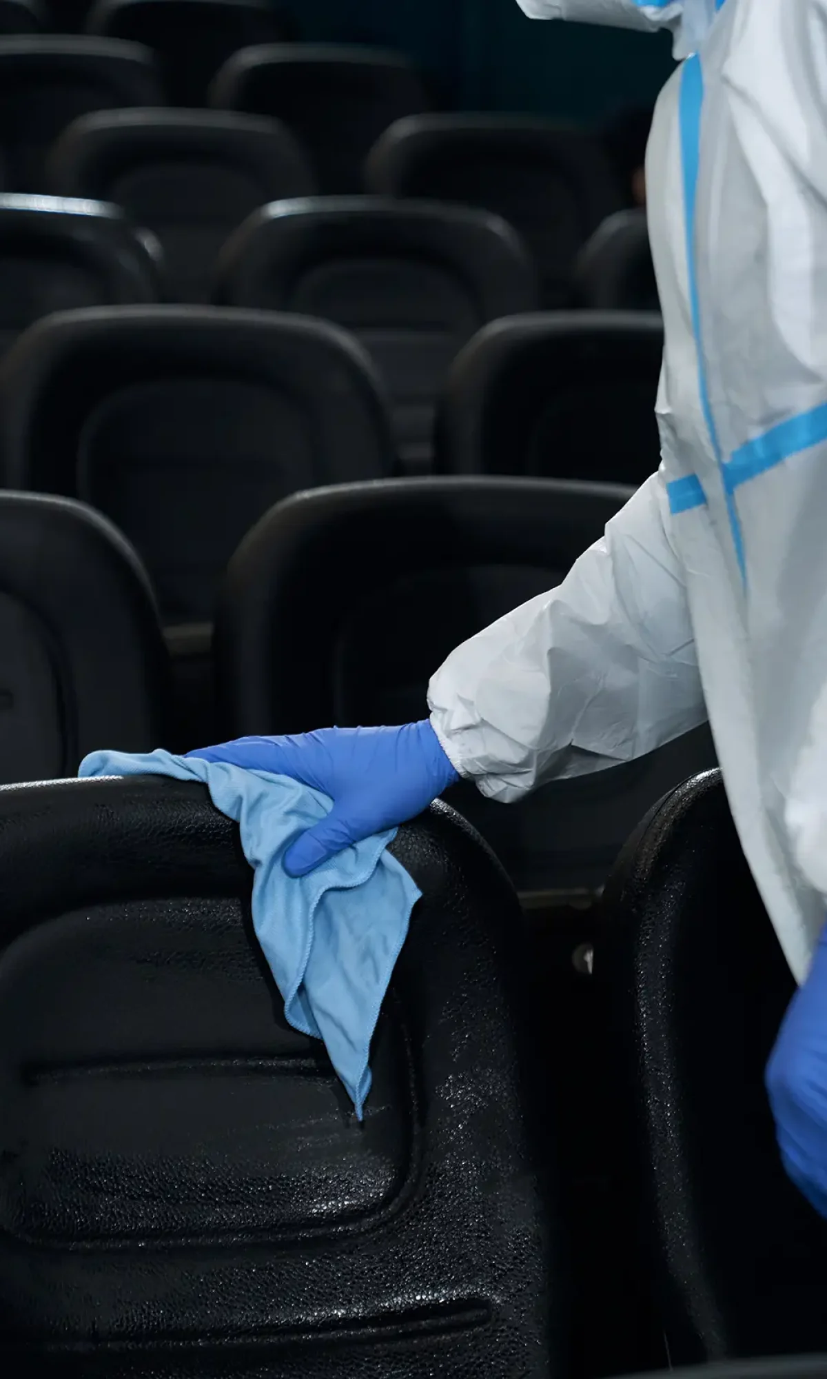 worker-holding-rag-and-wiping-chairs-in-cinema-2026-03-24-15-27-24-utc copy
